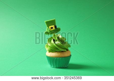 Delicious Decorated Cupcake On Green Background. St. Patrick's Day Celebration