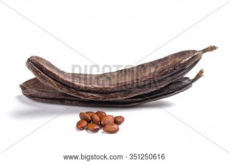 Carobs Pods With Beans Isolated On White Background
