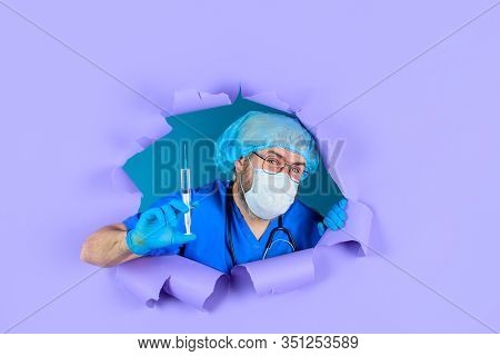 Through Paper. Doctor With Syringe. Coronavirus. Injection. Antibiotics. Doctor With Syringe Prepari