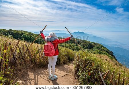 Young People Walking On A Hilltop In Doi Inthanon, Chiang Mai, Thailand