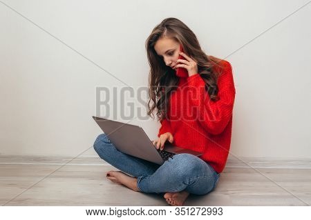 Girl With Laptop And Phone At Home.