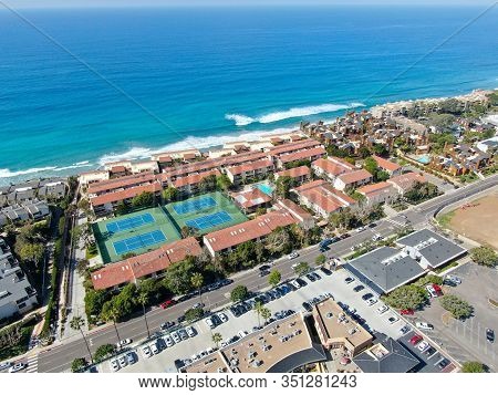 Aerial View Of Typical South California Community Condo With Tennis Court And Pool Next To The Sea O