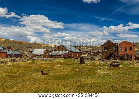 View Of The Bodie, Ghost Town. Bodie State Historic Park. Abandoned Wooden Houses And Standard Conso