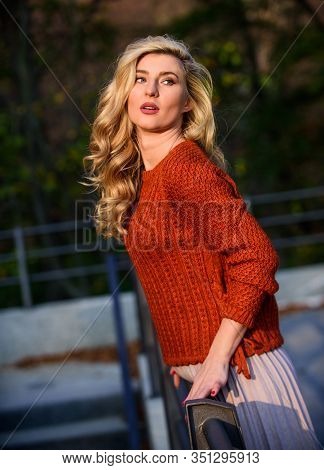 Trendy Beauty. Autumn Woman Curly Hair Outdoor. Girl Long Blond Hair City Walk. Girl In Corrugated S