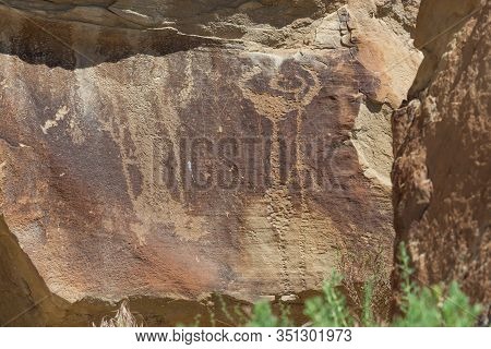 Strange Shapes And Figures That Have Been Carved Into The Ancient Sandstone Rocks At Legend Rock Sta