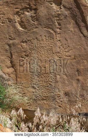 Strange Shapes And Figures That Have Been Carved Into The Ancient Sandstone Rocks At Legend Rock Sta