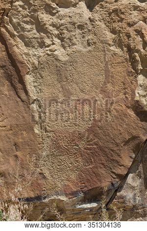 Strange Shapes And Figures That Have Been Carved Into The Ancient Sandstone Rocks At Legend Rock Sta