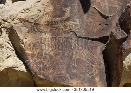 Strange Shapes And Figures That Have Been Carved Into The Ancient Sandstone Rocks At Legend Rock Sta