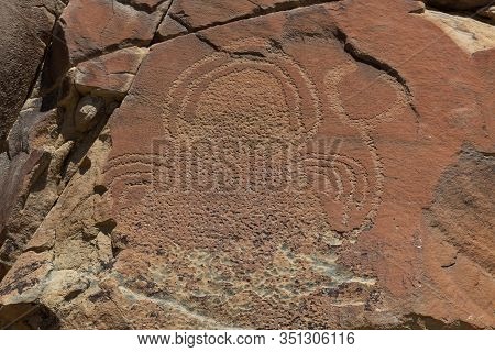 Strange Shapes And Figures That Have Been Carved Into The Ancient Sandstone Rocks At Legend Rock Sta