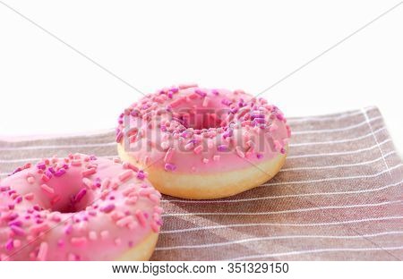 Donuts With Pink Icing And Marshmellow. Unhealthy Food Concept. Dougnuts On Thr Table
