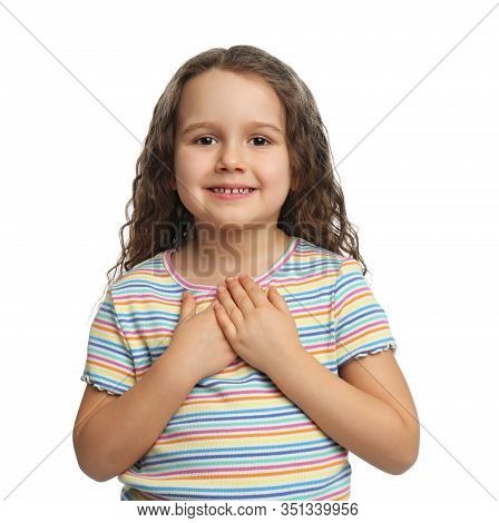 Cute Grateful Little Girl With Hands On Chest, White Background
