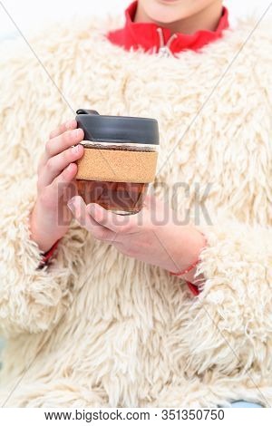 Yong Woman Hands Hold Reusable Glass Cup. Sustainable Living. Eco Friendly, Zero Waste Concept.