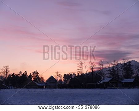 Village Twilight Against The Mountains, February 4, 2020, Russia, Arshan