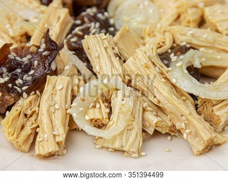 Close-up Spicy Chinese Or Korean Yuba Tofu Bamboo And Oyster Mushrooms On Wooden Background.