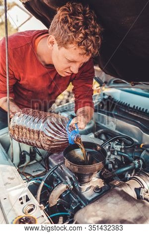The Concept Of Disability Of People And Their Adaptation To Life.a Disabled Person Pours Engine Oil 