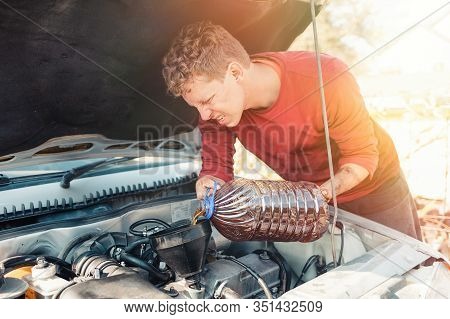 The Concept Of Disability Of People And Their Adaptation To Life. A Disabled Blonde Man Repairs A Ca