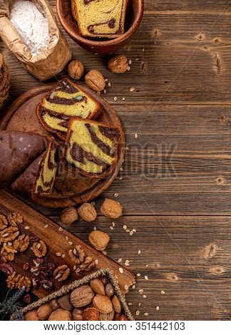 Flat Lay Of Brioche Style Sweet Loaf With Walnuts And Raisins, Copy Space