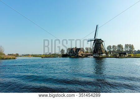 Waterways Of North Holland And View On Traditional Dutch Wind Mill, Dutch Lifestyle Landscape