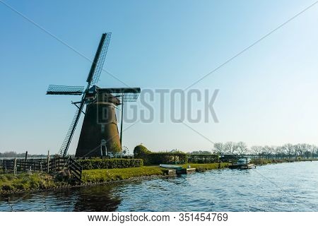 Waterways Of North Holland And View On Traditional Dutch Wind Mill, Dutch Lifestyle Landscape
