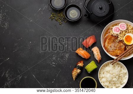 Set Of Traditional Japanese Food And Drinks: Soup Ramen, Boiled Rice, Sushi, Rolls And Green Tea In 