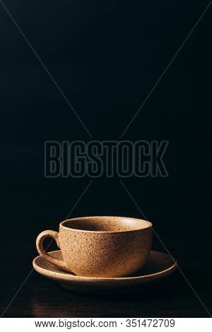 Cup With Black Coffee On A Black Background.