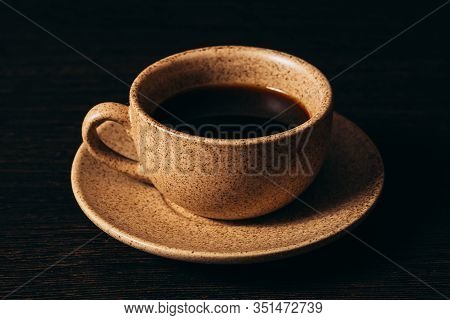 Cup With Black Coffee On A Black Background.
