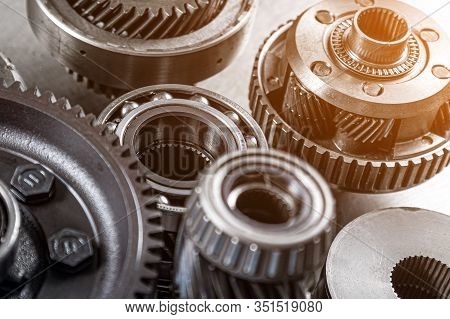 Set Of Various Engine And Gearbox Spare Parts. Shiny Gears For Planetary Gearbox.metal  Autotechnolo