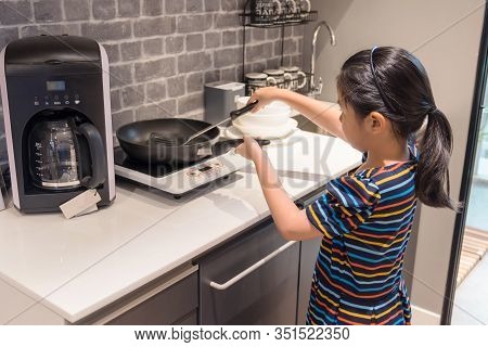 Little Asian Girl Chld Try To Cook Independently, Cooking Concept