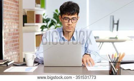 Young Asian Businessman Concentrate On Working With Laptop Computer At Office, Asian Office Man Comt