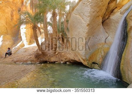 Chebika, Tunisia - December 16, 2019: The Oasis Of Chebika Near Nefta, With A Waterfall, Palm Trees 