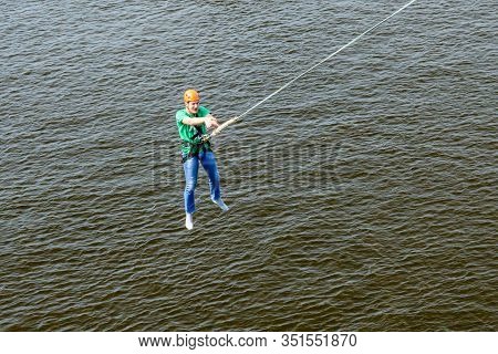 Kiev, Ukraine - July 28, 2018: Young Man Bungee Jumper Jumping From Bridge