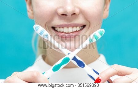 Beautiful Girl Clamps A Toothbrush Between Teeth , Close-up