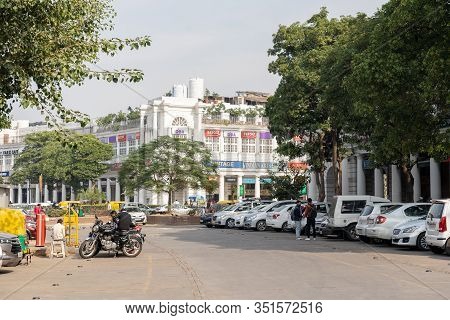 New Delhi, India - December 4, 2019: People And Classic Facades Of Columns At Connaught Place.