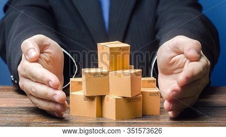 Businessman Covers Boxes Goods. Business Management. Commodity Circulation Import Export. Support Ma