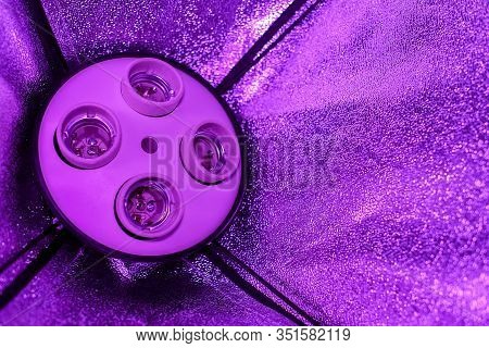 Empty Plafonds Without Lamps In A Studio Softbox With Reflectors Stand In The Lilac Half-light.