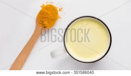 Diet Nutrition. Turmeric Powder, Mandeln Milk On White, Panorama. Indian Oriental Low Cholesterol .