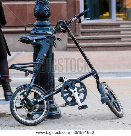 Moscow, Russia -  February, 2, 2020: the image of a folding bike parked on Moscow street