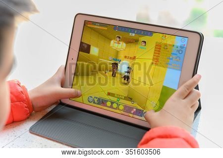 Zhongshan China-february 18,2020:kid Playing A Game Name Minecraft.
