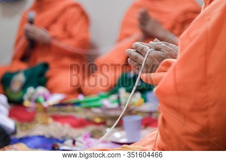 Buddhist Monk Praying Hands In Buddhism Tradition Ceremony.
