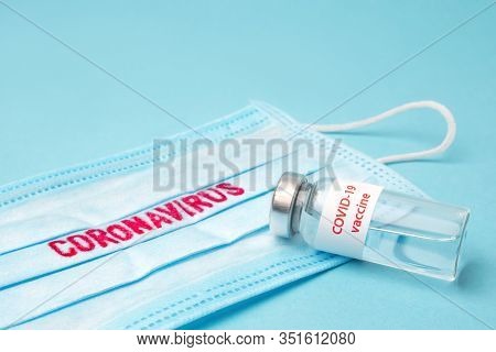 Covid-19. Vaccine From Covid-19. Blue Medical Disposable Face Mask With Covid-19 Print. Dangerous Vi