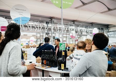 Strasbourg, France - Feb 16, 2020: Visitors People Tasting Bio Organic Agriculture Biologique French