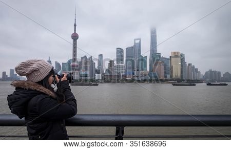 Shanghai, China - January 09 2020: The Unspecific Girl Taking Photo At The Shanghai Waitan 