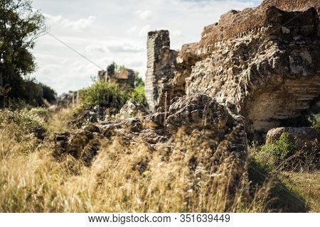 Ruins Of Ancient Romanian Aqueduct De Barbegal In Provence, France In Hot Summer Day. Archeological 