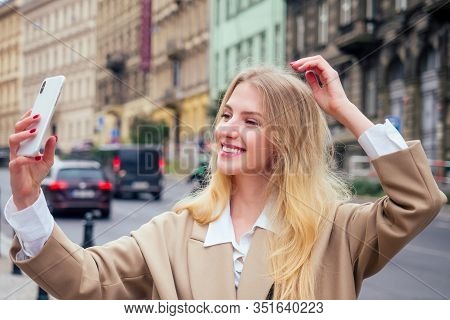 Beautiful Rich Casual Blonde Stylish Fashion Business Woman With A Phone In Her Hand Make Selfie In 
