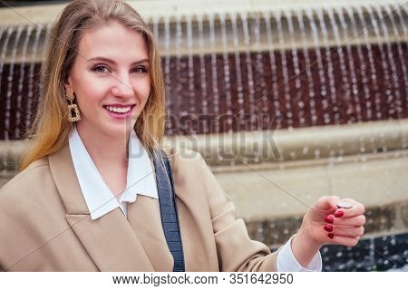 Young Blonde Woman Makes A Wish At The Prague Chezh Fountain