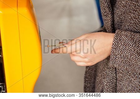 Young Woman Hand Inserts The Bus Ticket Into The Validator, Validating And Ticking In Prague Sity Ch
