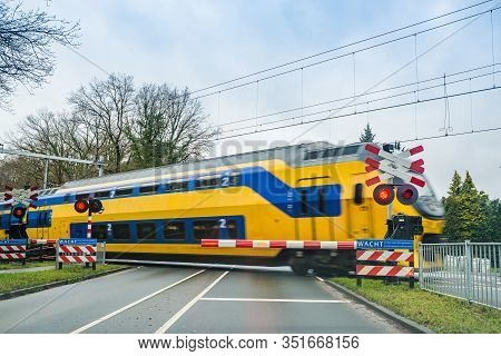 Zeist, Netherlands - January 04, 2020. Railroad Crossing With Red Lights