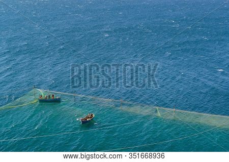 Tarkhankut, Crimea, Russia-september 11, 2019: People On Boats Check Nets In The Black Sea. Fisherma