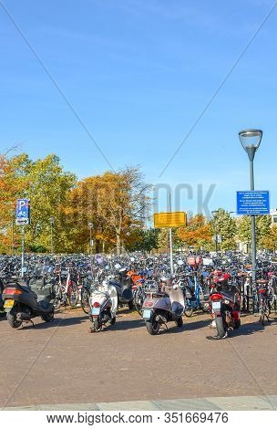 Venlo, Limburg, Netherlands - October 13, 2018: Rows Of Parked Bicycles And Motorcycles In The Dutch