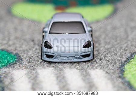 Lubartow, Poland - 20 November 2019: Toy Car Has Stopped In Front Of Crosswalk On Car Town Carpet St